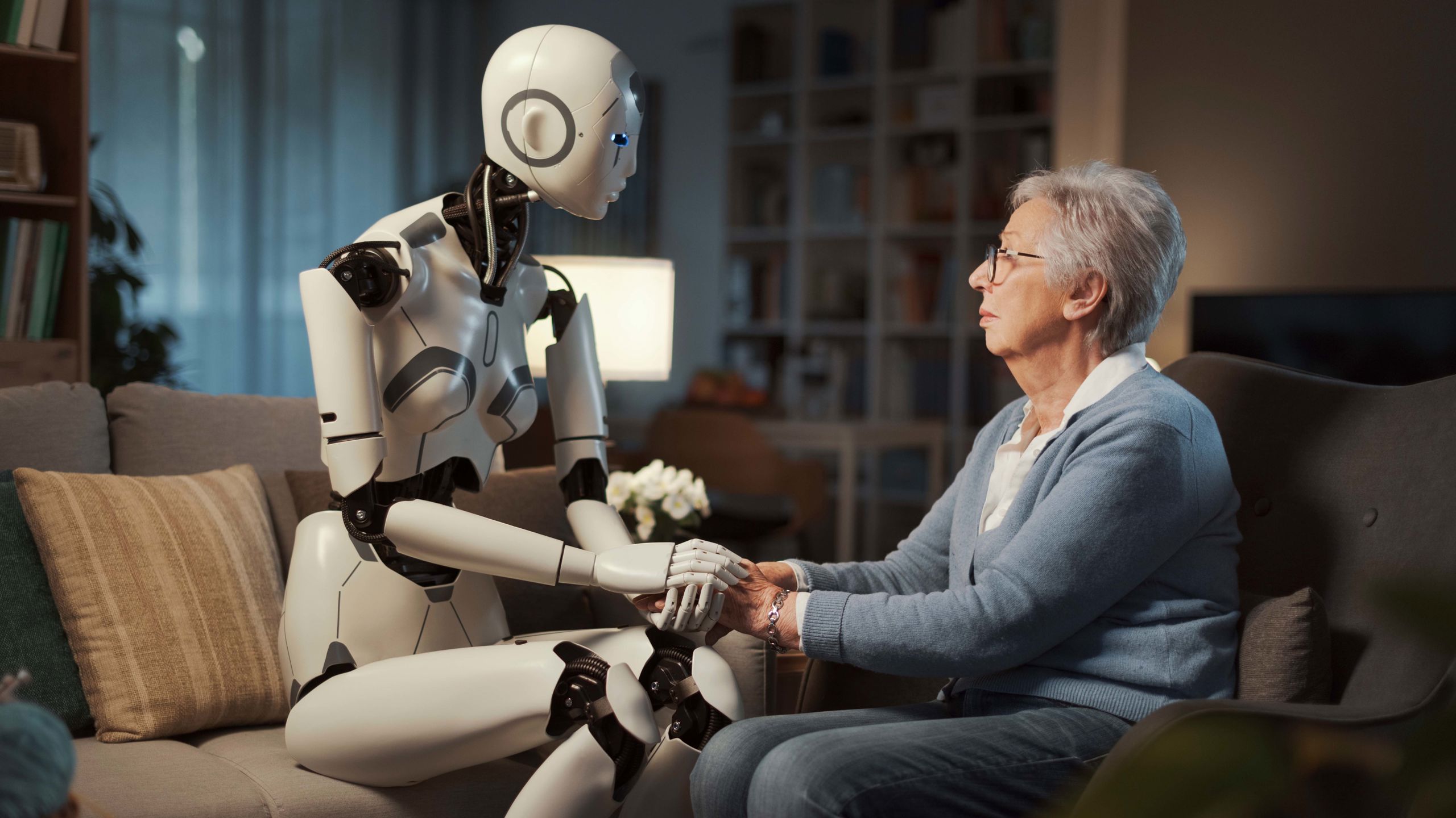 Woman holding hands with robot