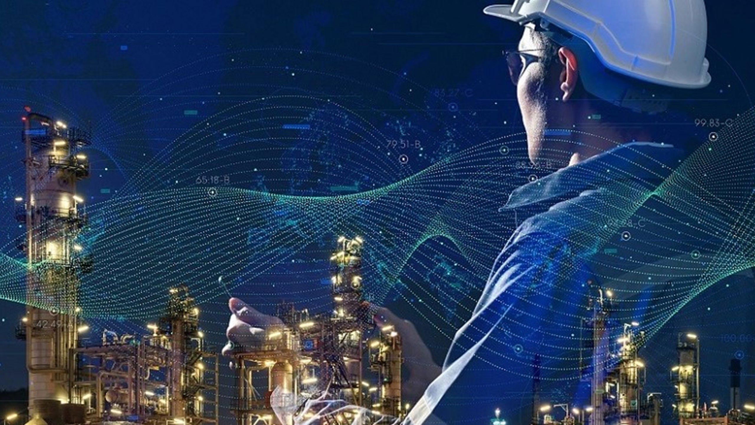 Bilde av oljearbeider på nattid