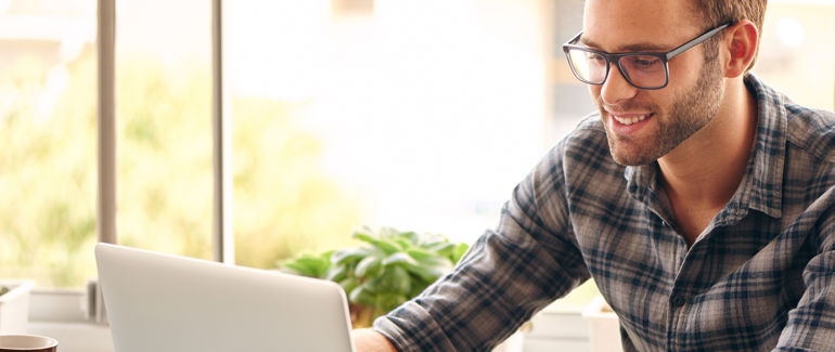 Man working on a laptop (illustration)